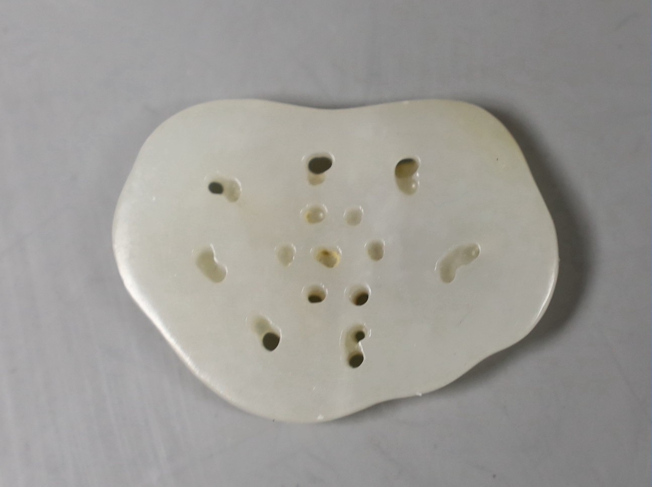 A Chinese white and russet skin jade ‘butterfly’ plaque, 3,5 cms long